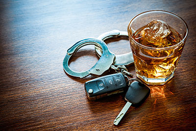 Car keys, handcuffs and alcohol